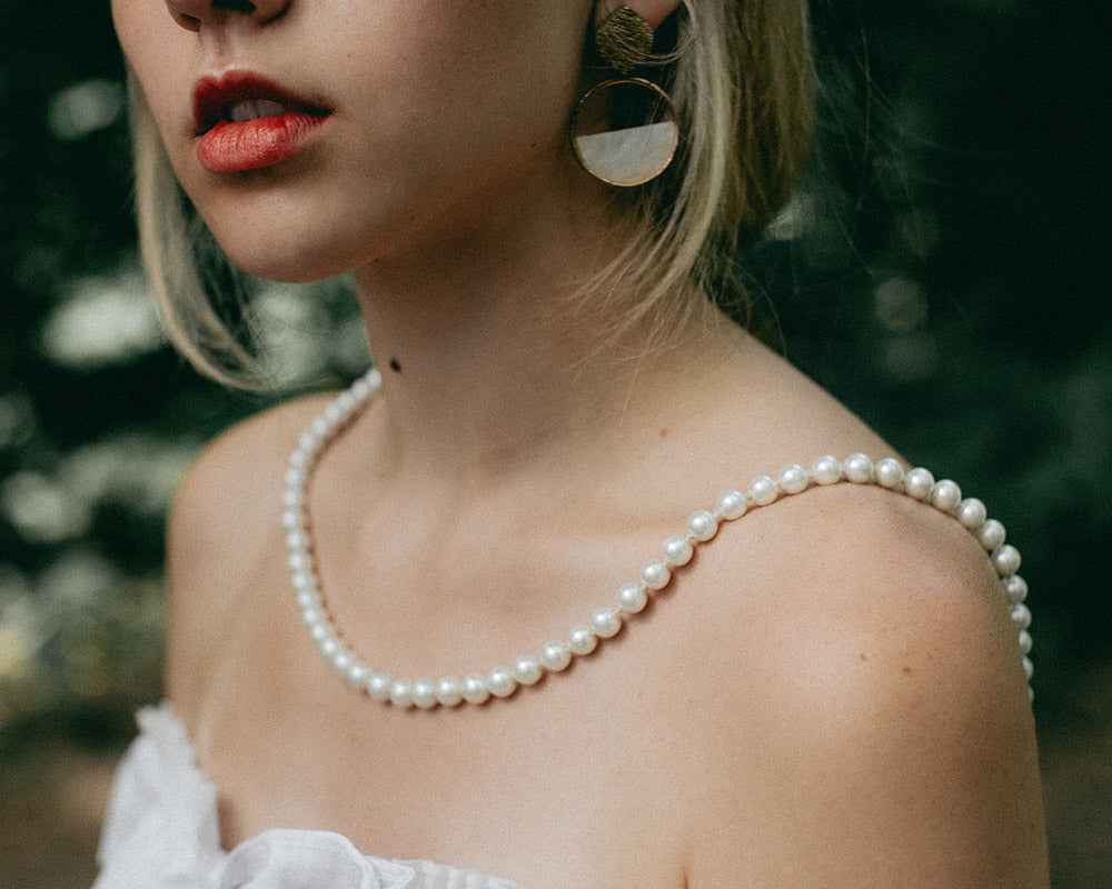 Draped in pearls, embodying elegance with every curve. This pearl